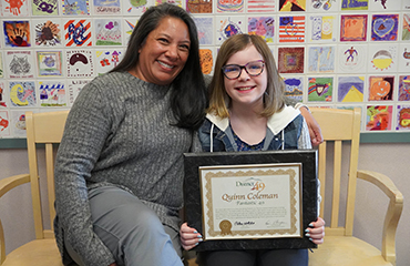  Quinn Coleman, fifth grader at SRES, receives a Fantastic 49 Award.
